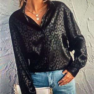 black leopard print button up. worn once . size large.